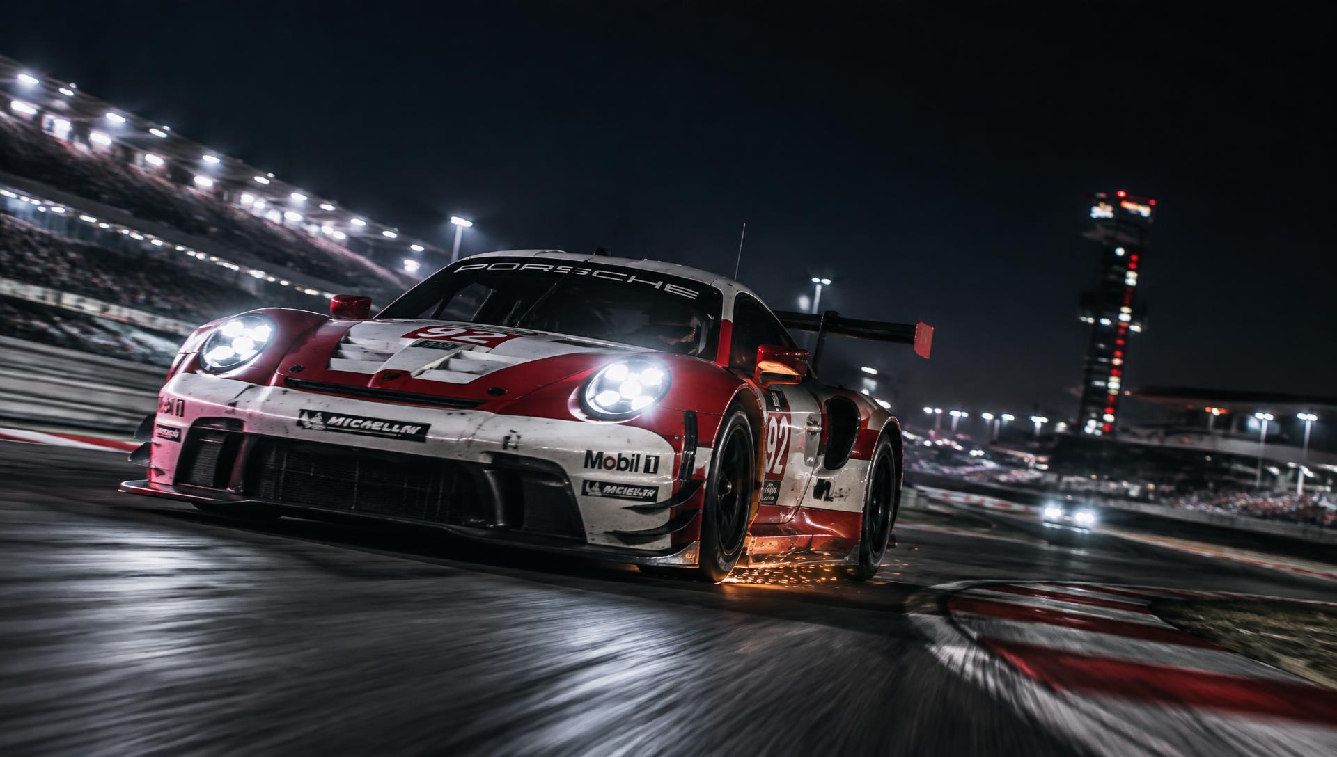 GT race car cornering at night